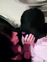 North East dominatrix Mistress Orchid with a hooded submissive