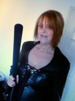 Durham UK dominatrix in leather wielding a tawse